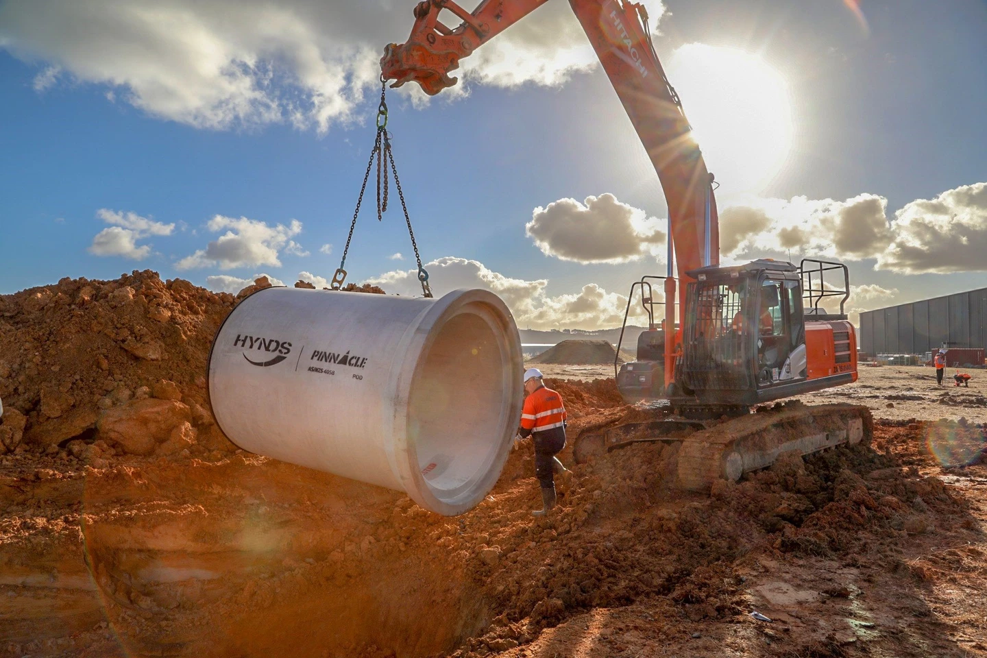 A concrete pipe going into the ground