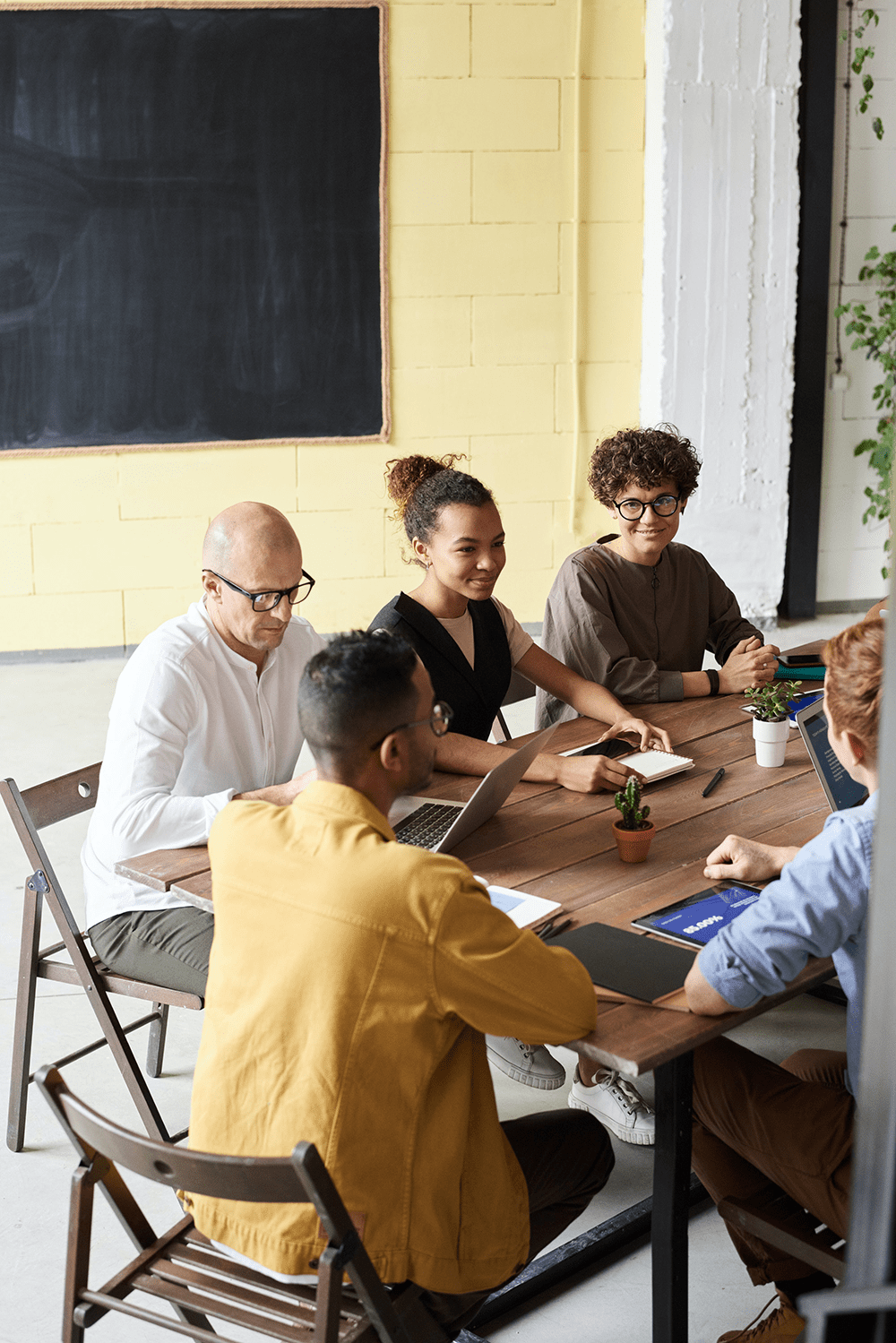 A group of people brainstorming around a table
