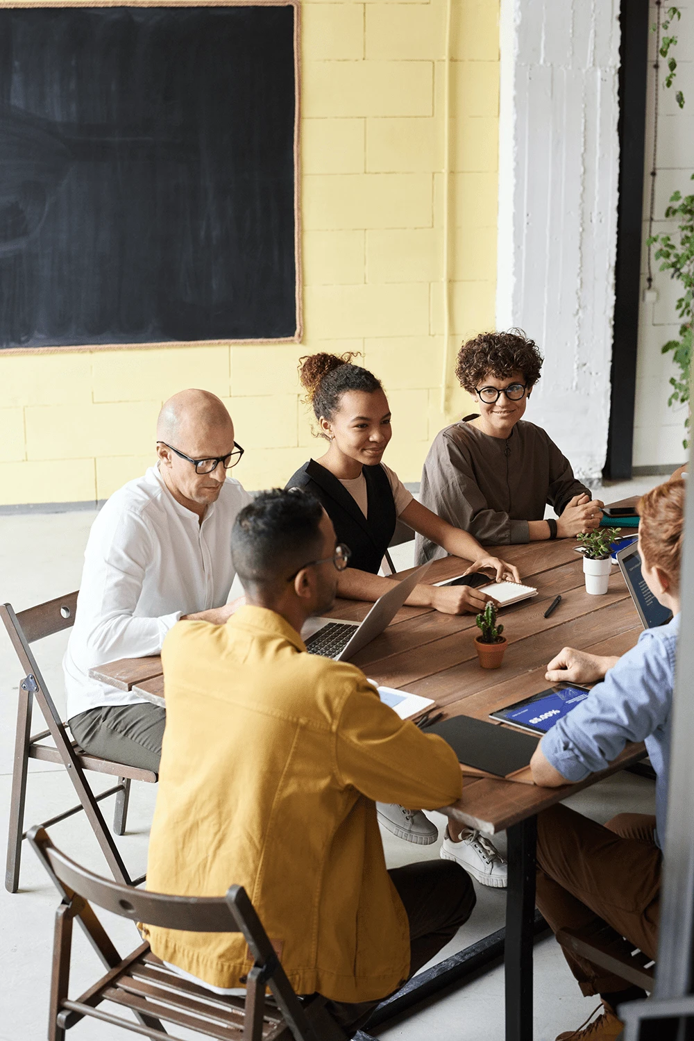 A group of people brainstorming around a table
