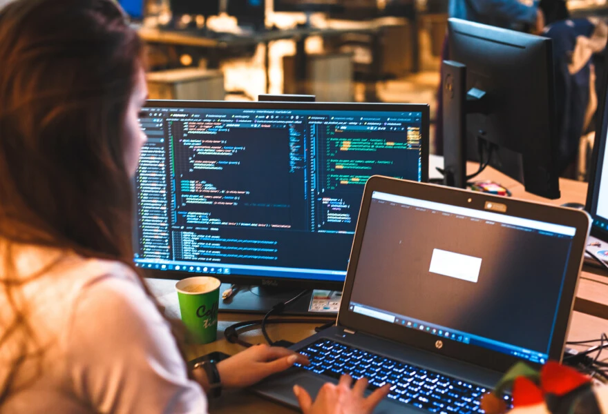 Woman coding and working with an API