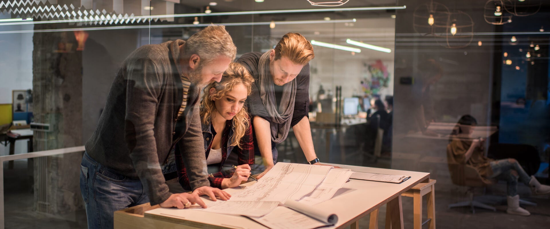 Woman and two men creating modular content