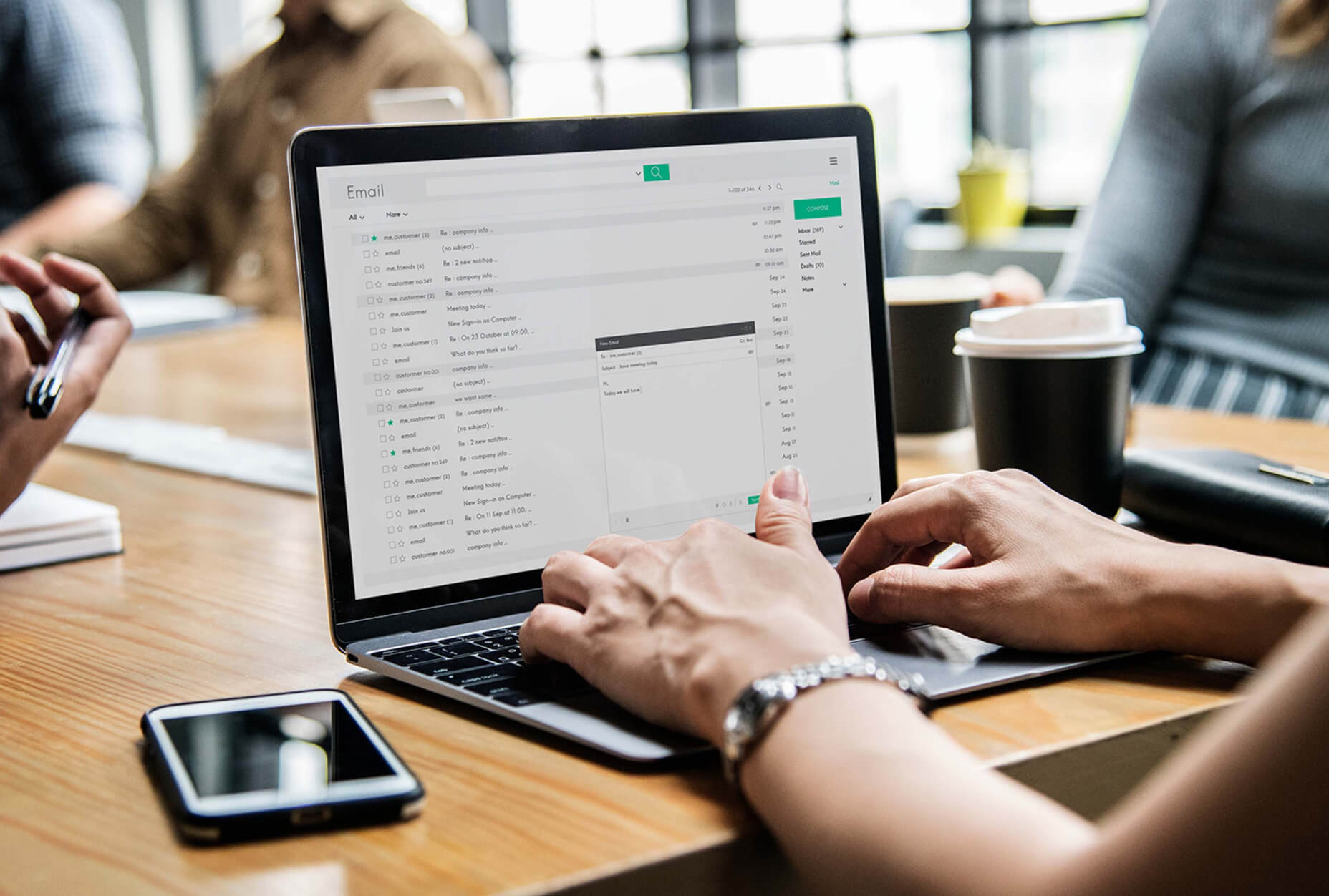 A person typing on a laptop