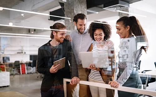Marketers in the office reading an announcement