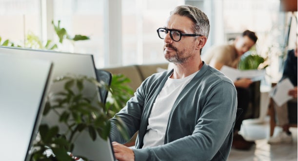 A man working with content in an office