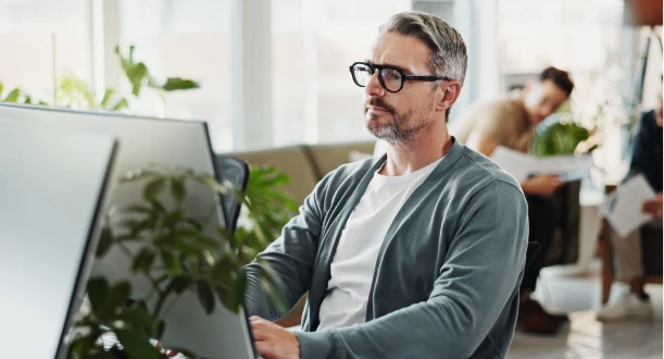 A man working with content in an office