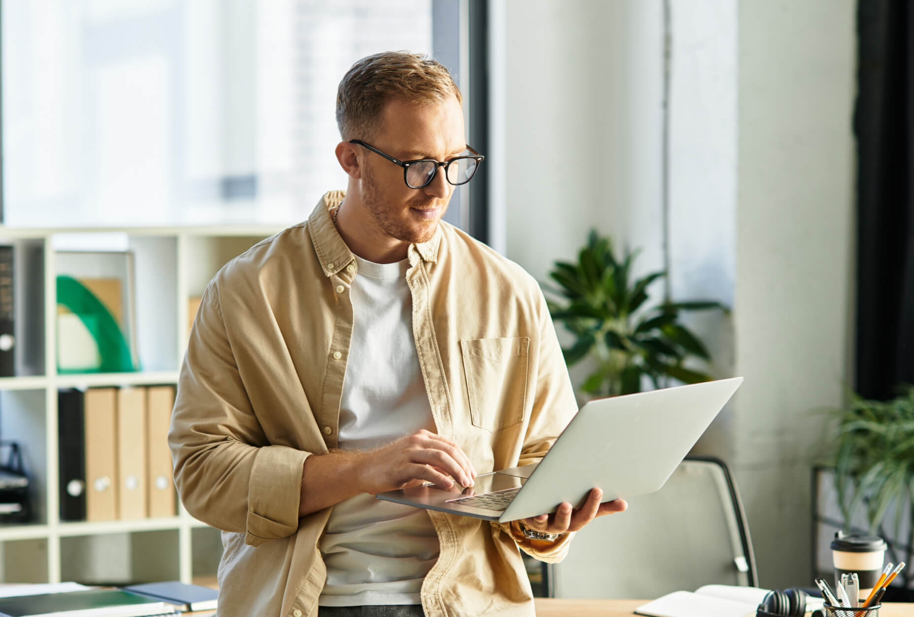 A man holding a laptop