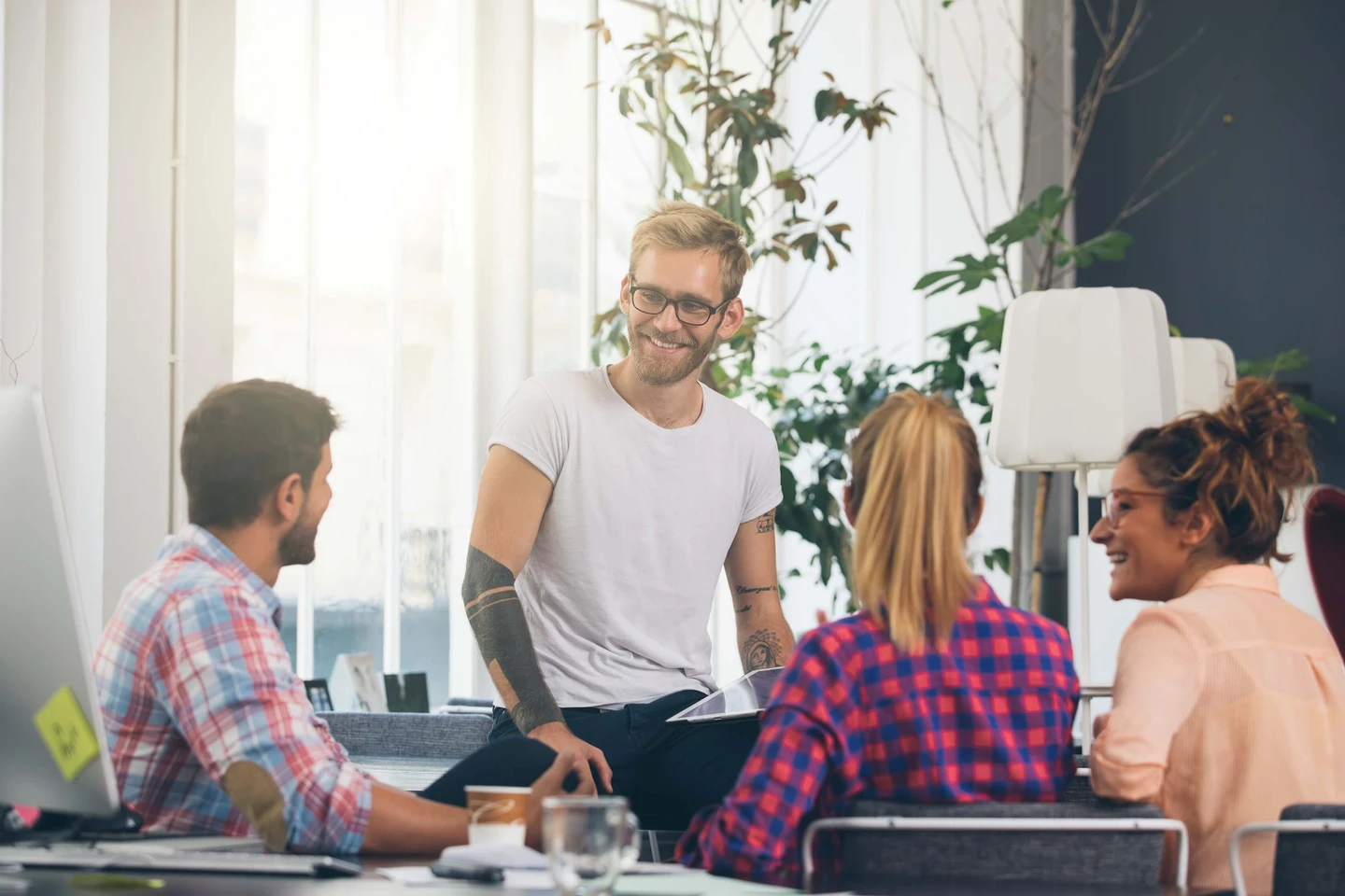 A group of people sitting around a table
