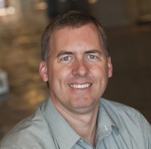 A close-up of a man smiling