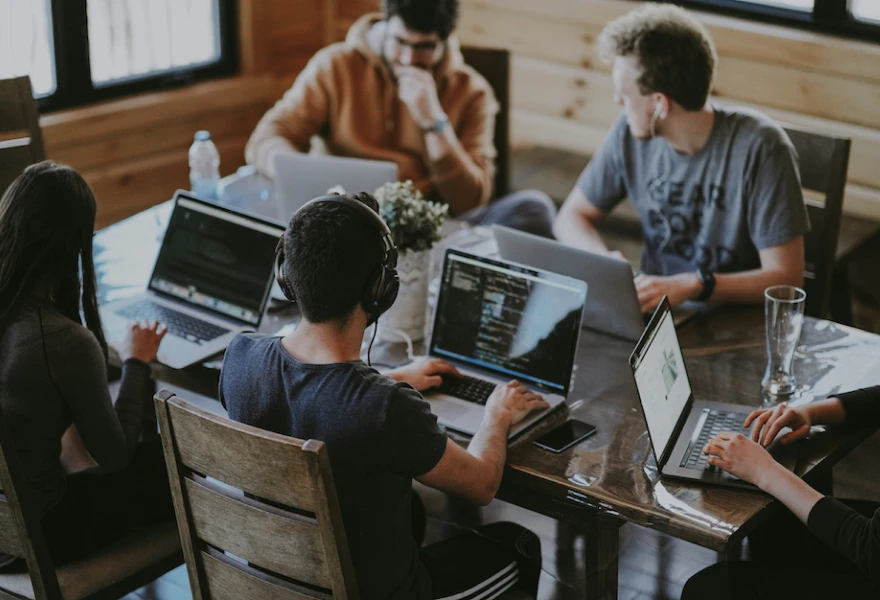Developers working together around a desk