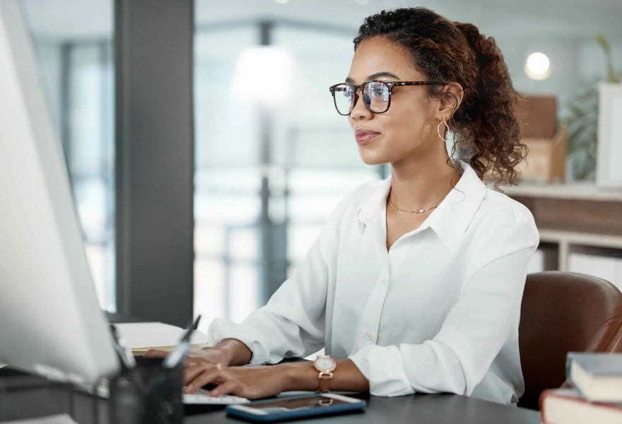Woman working at laptop in office