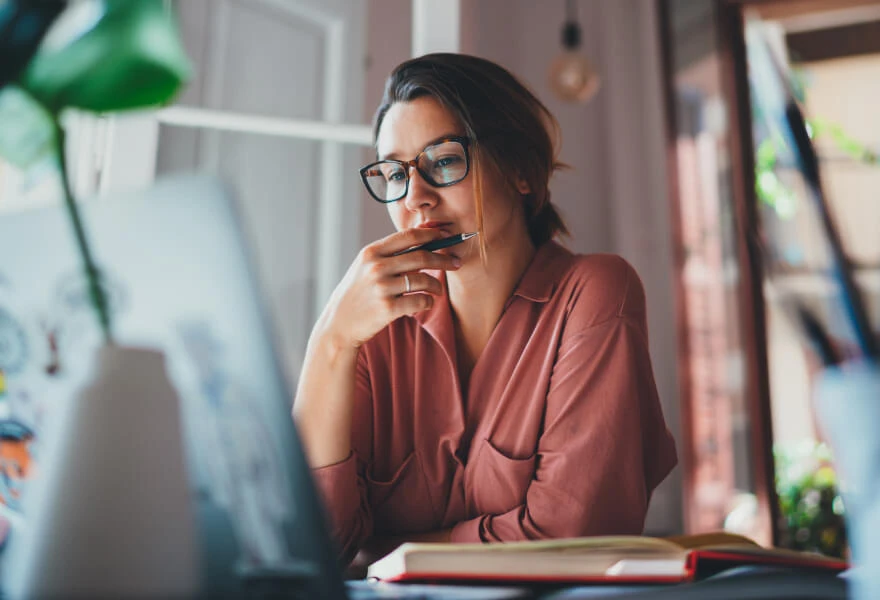 A woman thinking about the content she is writing for skimmers