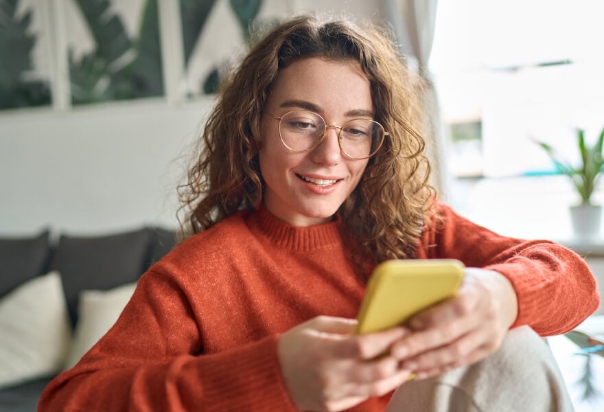 A woman looking at a phone