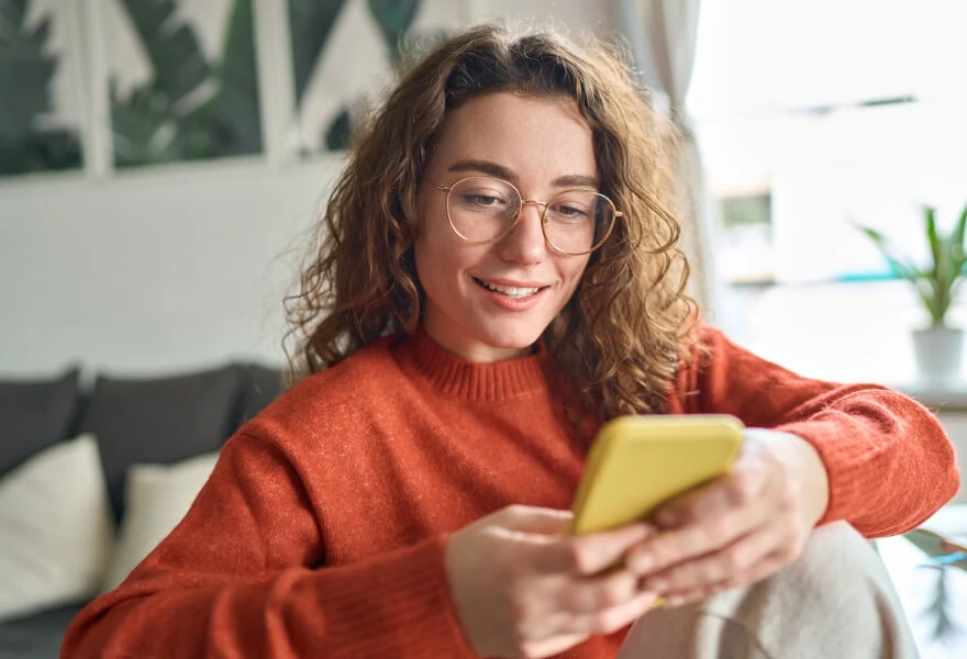 A woman looking at a phone