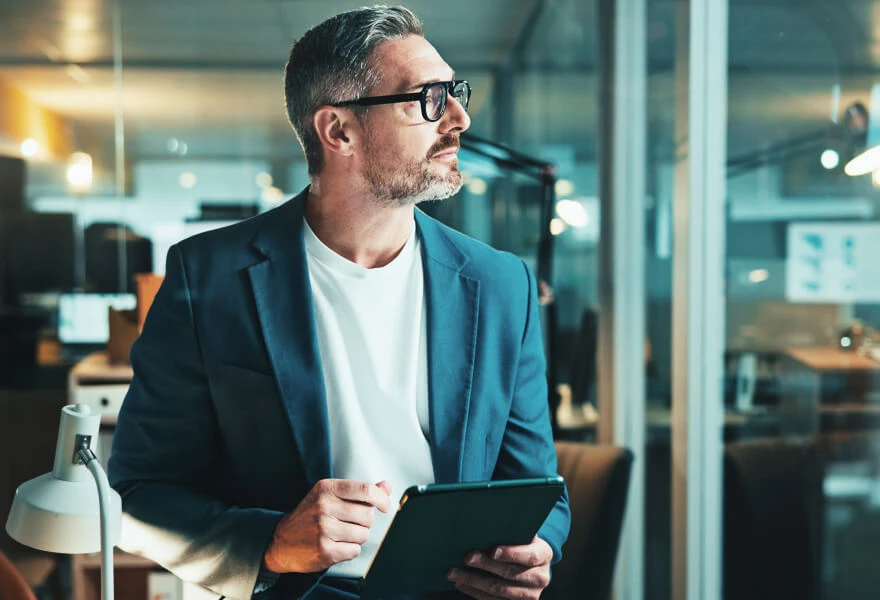A content professional looking out of the window